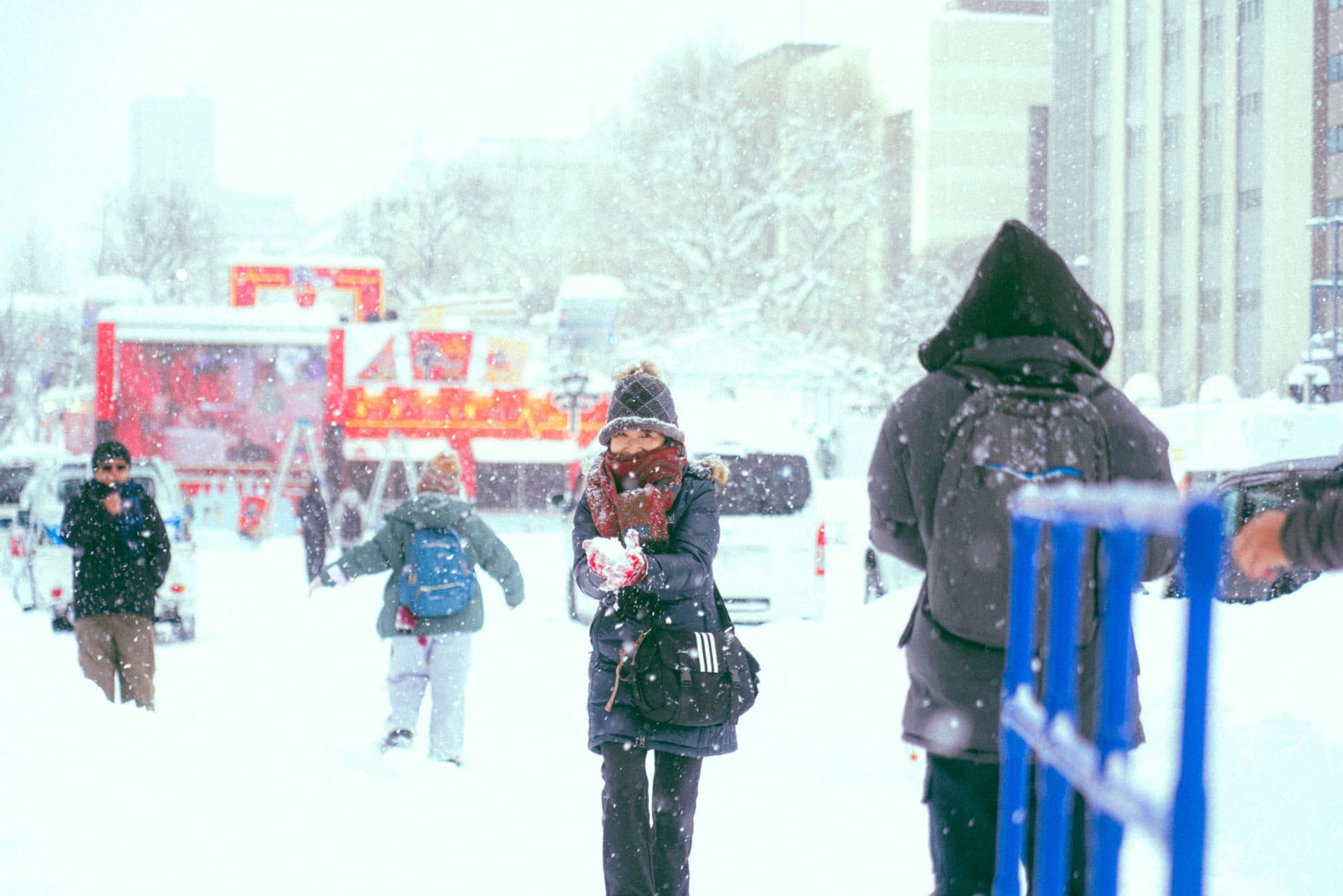 Snowy street scene with people in winter