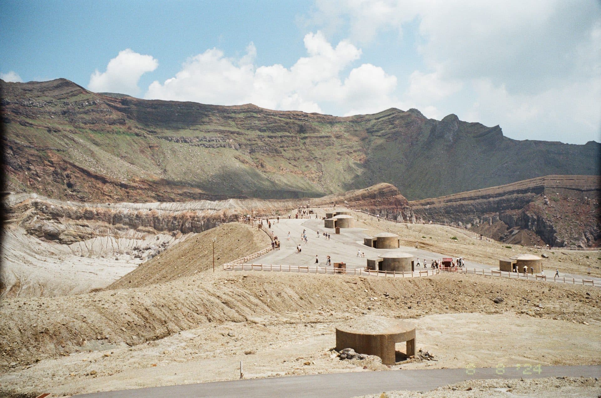 Tourists exploring the scenic mount aso crater japan