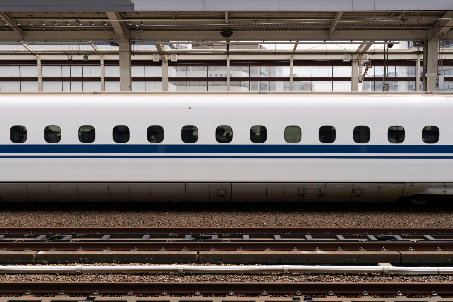 High-speed bullet train on a platform at a Japanese station