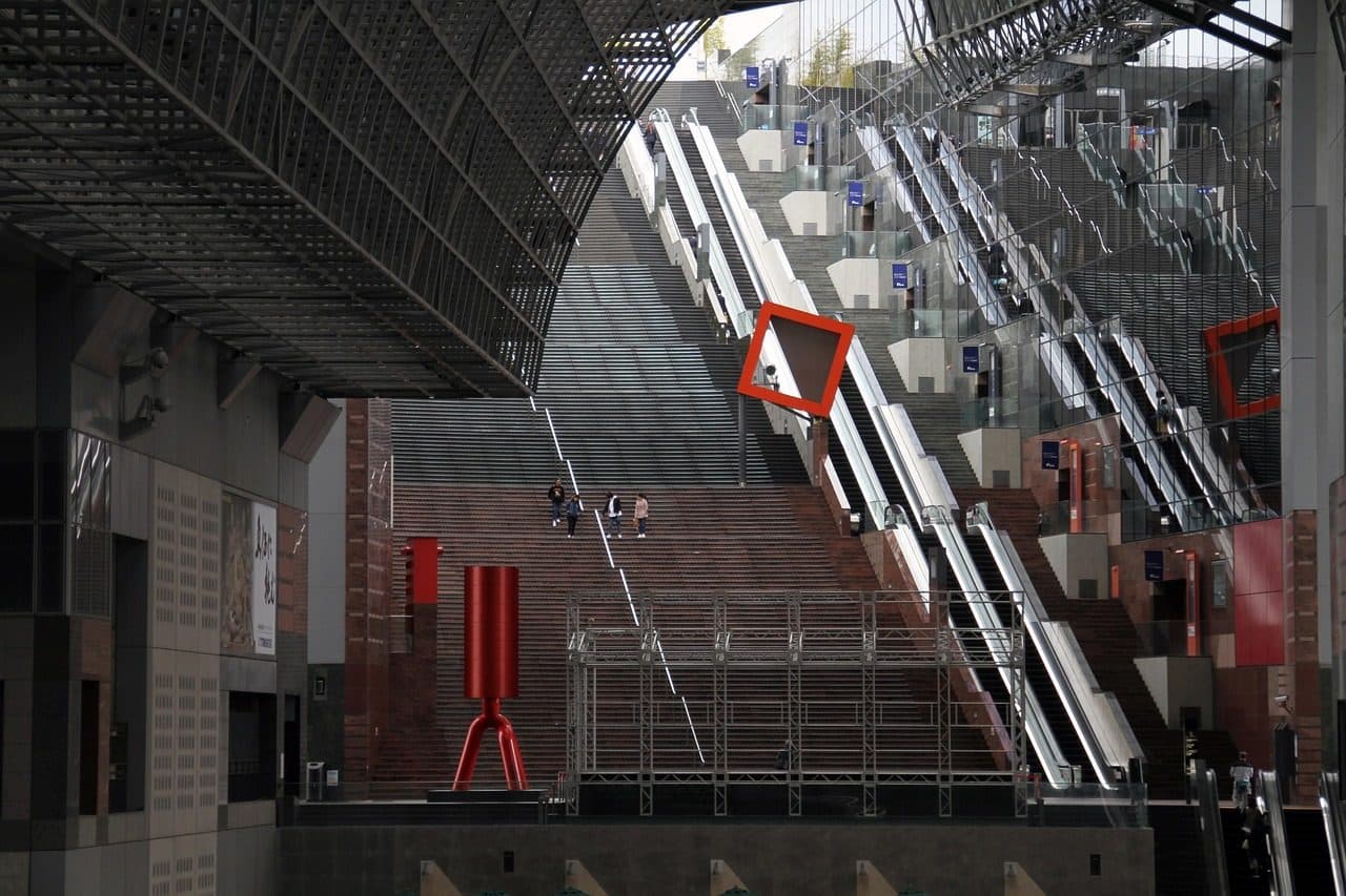 The great staircase inside Kyoto Station, with escalators rising through the glass-and-steel concourse